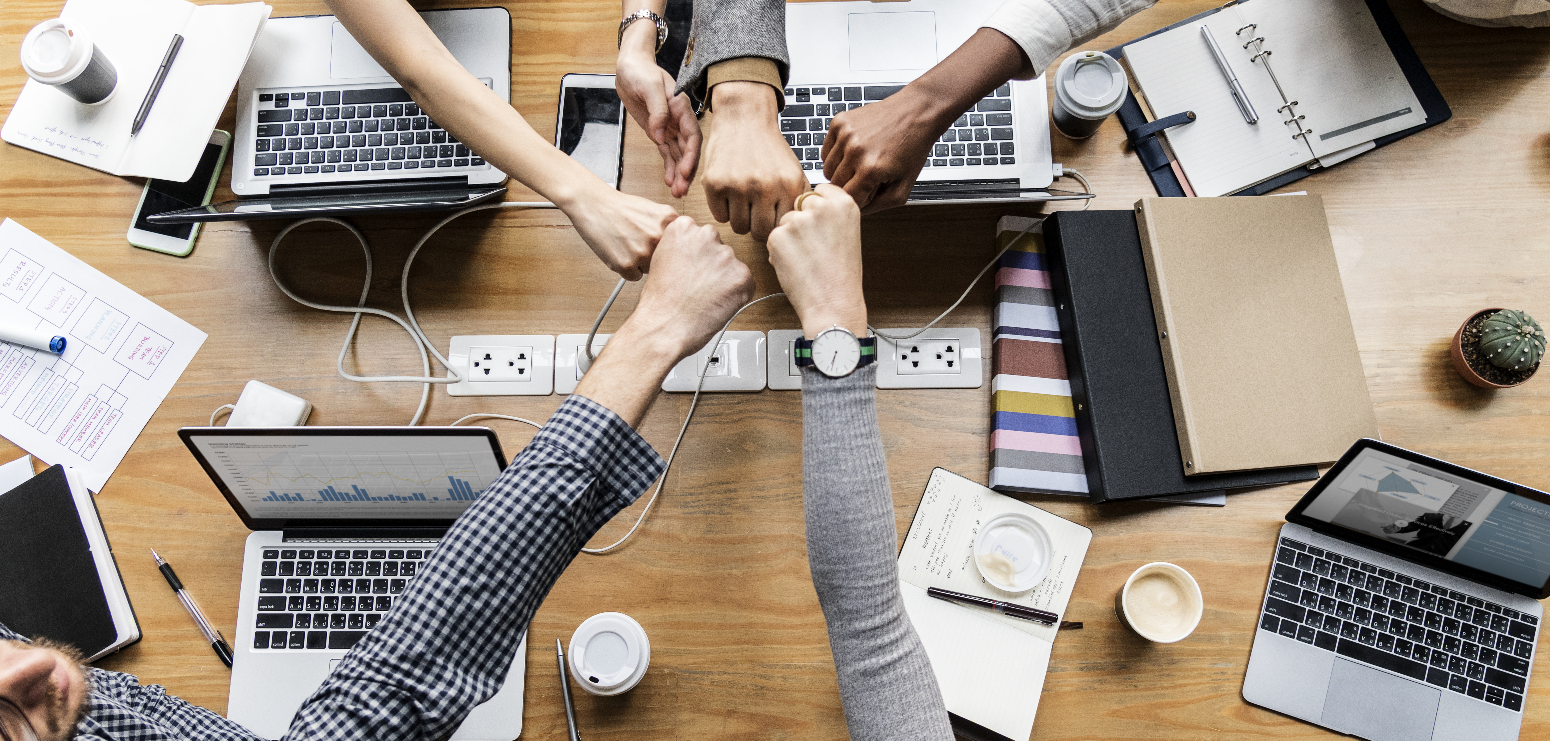 colleagues-giving-fist-bump colleagues-giving-fist-bump